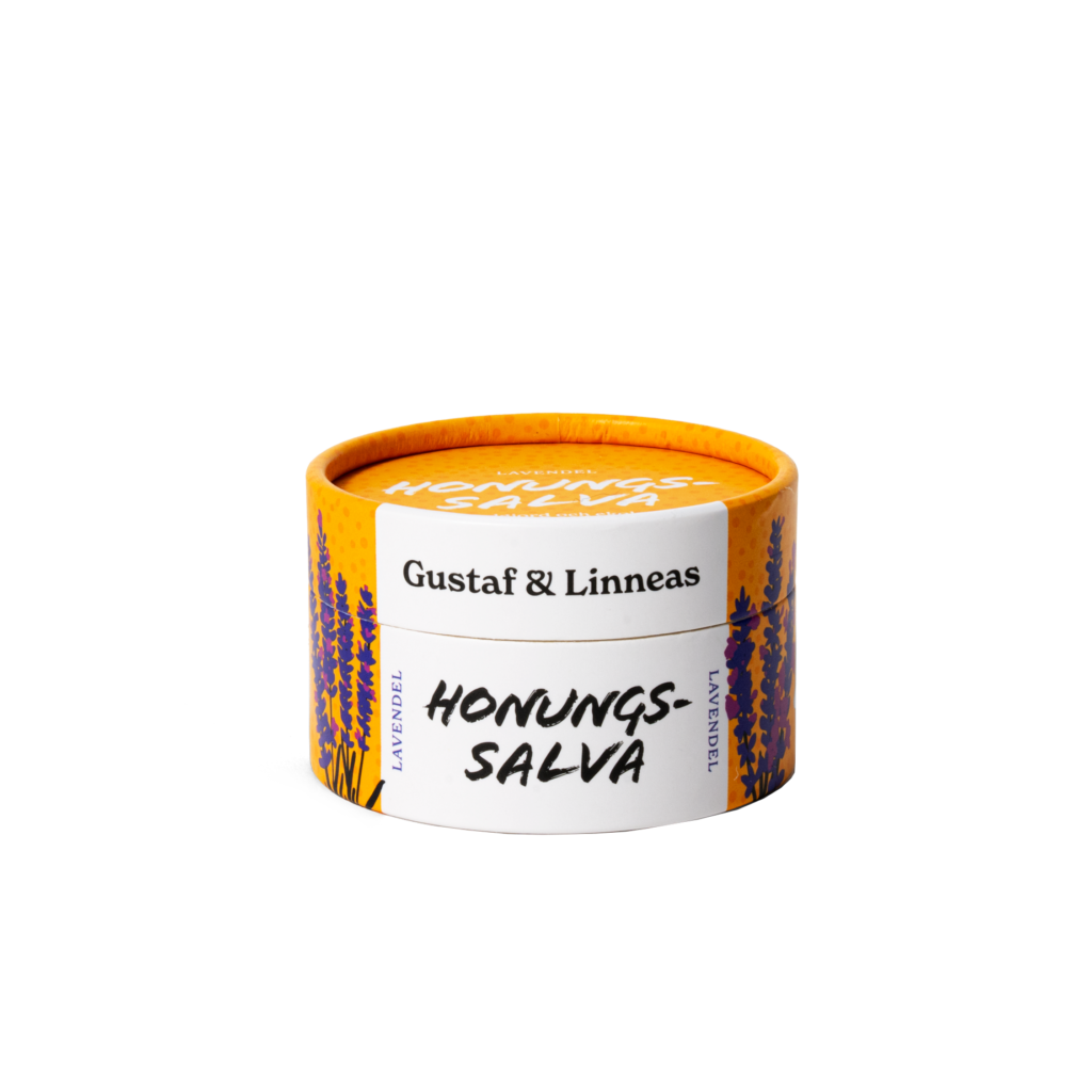 Stängd burk ekologisk honungssalva lavendel från Gustaf & Linnea med orange lock och vit etikett