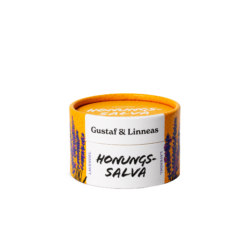 Stängd burk ekologisk honungssalva lavendel från Gustaf & Linnea med orange lock och vit etikett